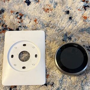 NEST Thermostat with White and Black Design